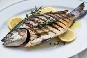 Grilled Branzino with herbs and lemon slices