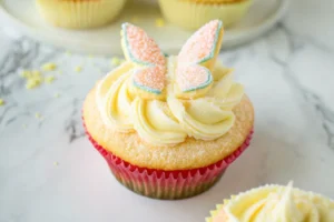 Close up view of freshly made butterfly cake on a white plate